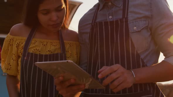 Young couple looking at the camera in food truck