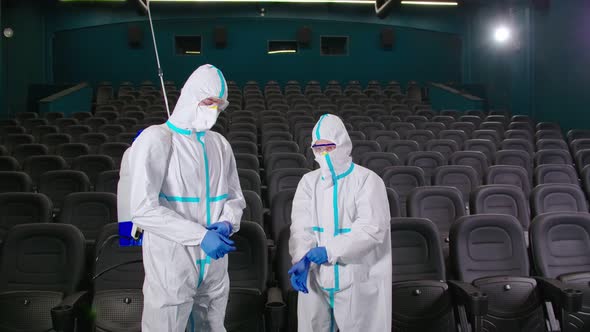 Medical Workers in Chemical Suit Disinfecting Cinema