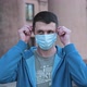 Man Takes Off His Medical Mask of Coronavirus Protection Outside and Smile - VideoHive Item for Sale