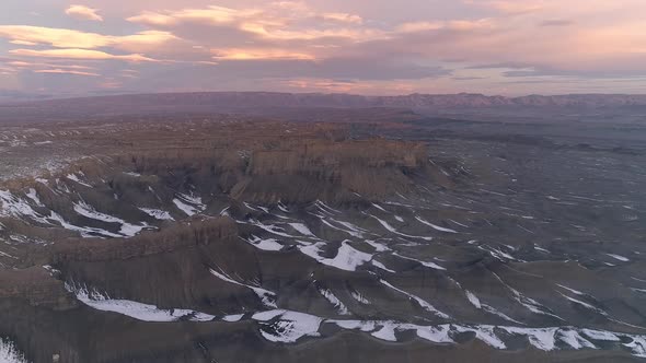 Aerial view of snow in the desert in Utah as it melts during sunrise