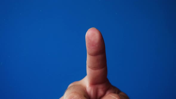 Human Hand Making Fingerprint on Blue Background