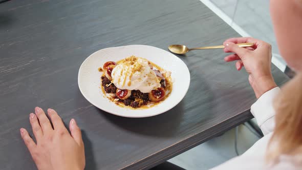 Young Beautiful Woman Eating a Dessert in Modern Restaurant High Kitchen Ice Cream Famous Chef