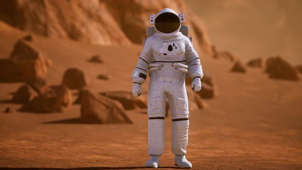 Astronaut on Mars Surface. Red Planet Covered in Gas and Rock