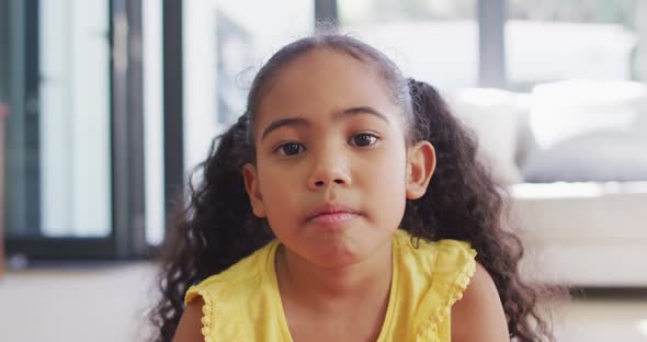 Portrait of happy biracial girl looking at camera