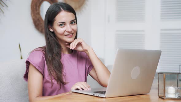 Portrait Beautiful Girl Sitting in Cafe with Laptop, Looking at Camera, Smiling