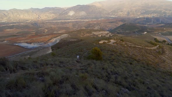 Off Road Motocross Biker Exploring in a Mountainous Landscape