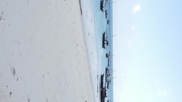 Vertical Video Boats in the Ocean Near the Coast of Zanzibar Tanzania Aerial View