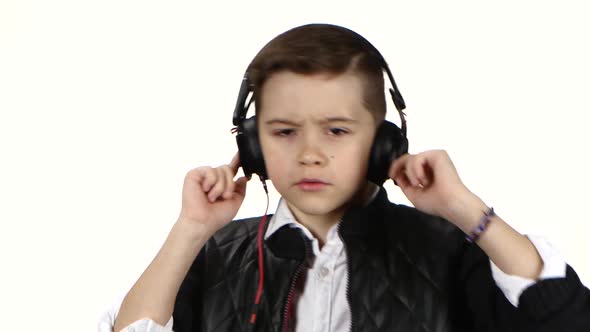 Teenager Boy Listens Music on Headphones and Dances, Close Ups