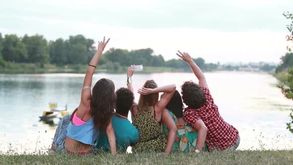 Group of friends having a great time taking selfies