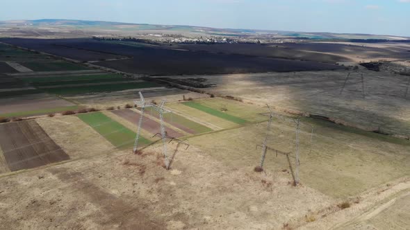 Flight Over Power Lines. High Voltage Transmission Lines of Thousands of Kilovolts