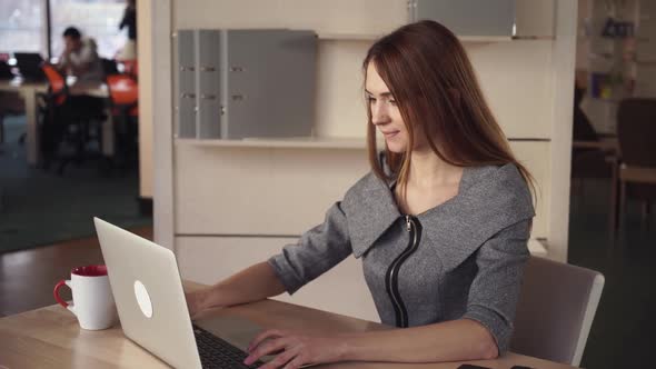 Businesswoman Throughs with Project Close Laptop and Enjoy Cup of Tea