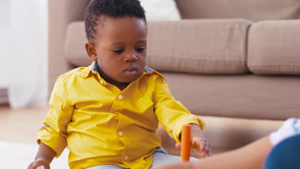 Mother and Baby Playing with Toy Blocks at Home 19