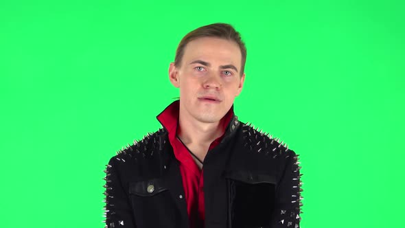 Guy Stands Waiting with Boredom. Green Screen