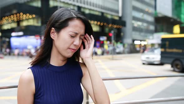 Woman suffer from headache at outdoor