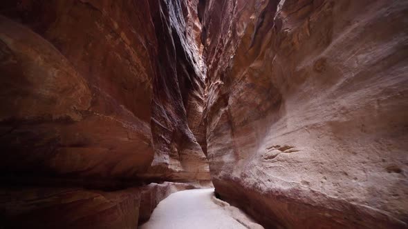 Al Siq Canyon With Red Rock Walls From Both Sides In Ancient City Of Petra