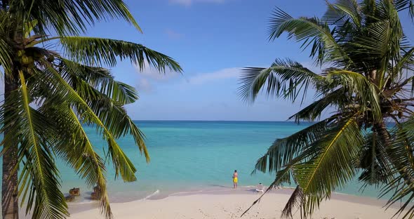 Happy boy and girl married on vacation spend quality time on beach on paradise white sand background