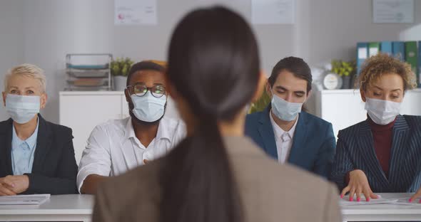 Executives Wearing Protective Mask Interviewing Woman Applicant