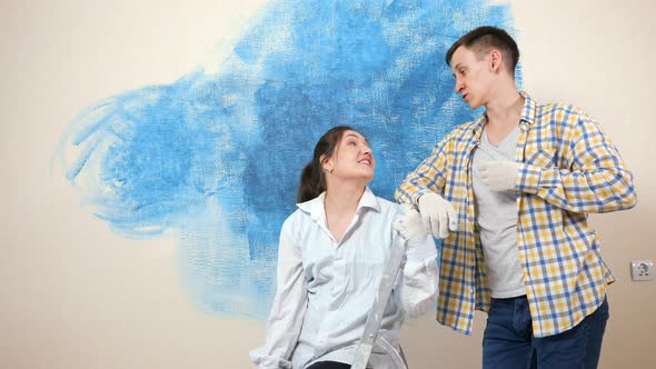 Young Woman Talks to Boyfriend Discussing Apartment Interior