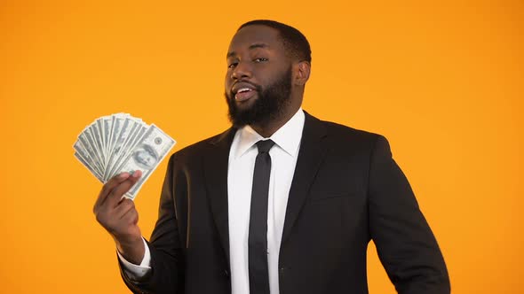 Satisfied Black Businessman Showing Dollar Cash and Thumbs-Up Gesture, Income