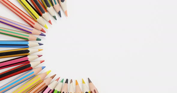 Colored pencils arranged in a semi-circle