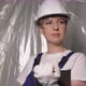 Woman Builder in Blue Overalls and White Hard Hat Helmet with Tablet Device - VideoHive Item for Sale