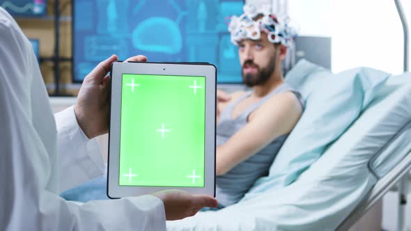 Patient Talking with Doctor and Wearing Brainwaves Scanning Headset