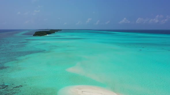 Aerial drone shot landscape of paradise lagoon beach voyage by transparent lagoon with white sand ba