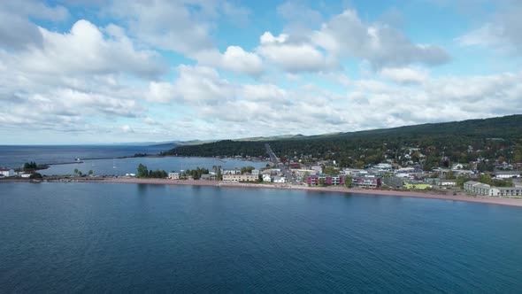 Drone aerial view over lake superior of Grand Marais in the summer