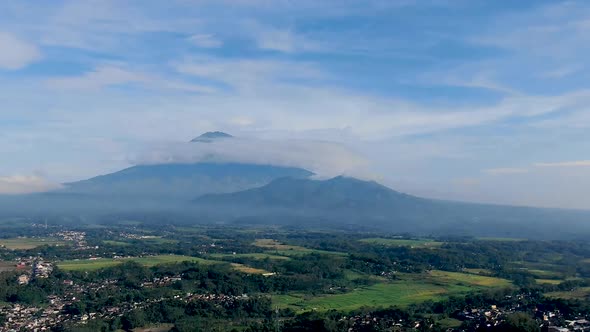 Clouds pass volcano peak of Mount Sumbing, Java, Indonesia, time lapse