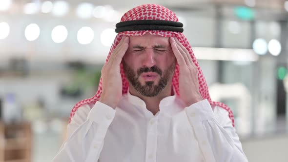 Exhausted Arab Businessman Having Headache