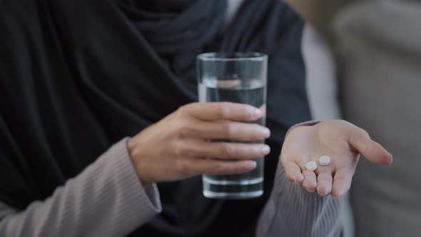 Close Up Unknown Sick Woman Islamic Muslim Patient in Hijab Female Hands Holding Pill From Headache