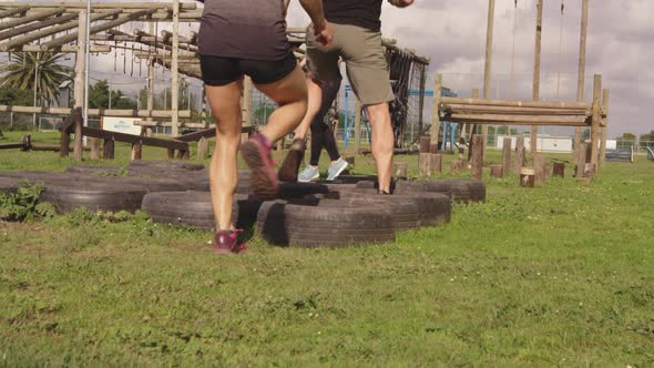 Young adults training at an outdoor gym bootcamp