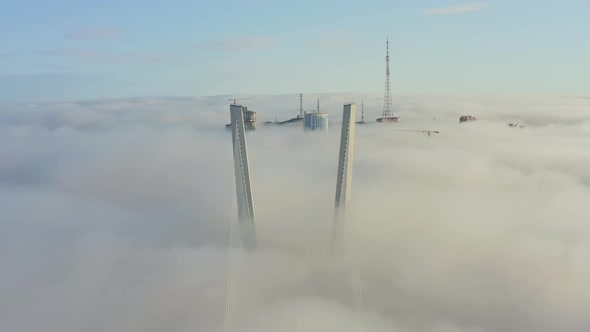 Tops of the Pylons of the Golden Bridge in the Dawn Fog in Vladivostok