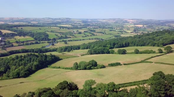 Green rolling pastures outside Exeter, Aerial PAN RIGHT