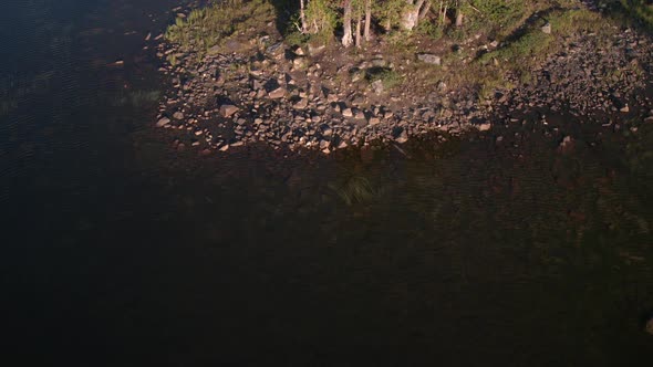 Looking down while flying over lake