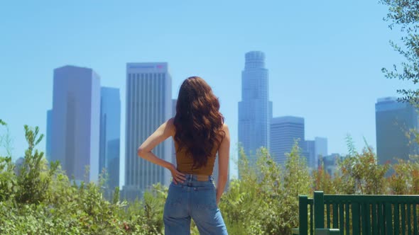 Unknown Brunette Looking Blurred Cityscape