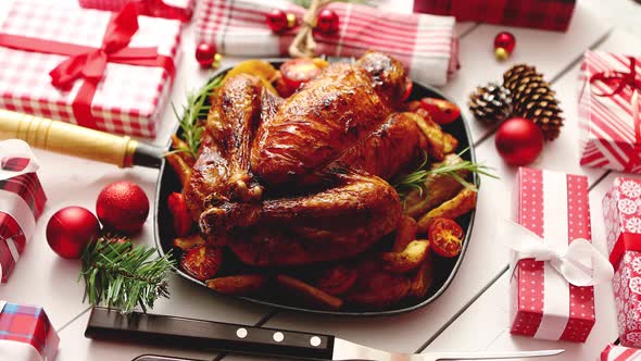 Roasted Whole Chicken or Turkey Served in Iron Pan with Christmas Decoration