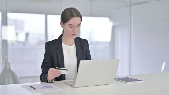 Young Businesswoman Reacting To Online Payment Failure on Laptop 