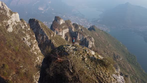 Hiker on top of the mountain, Lake Como, European Alps, Italy