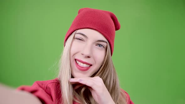 Girl Makes Selfie with Different Emotions. Green Screen. Close Up. Slow Motion