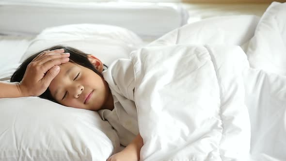 Cute Asian Child Sleeping On White Bed With Mother Care Slow Motion