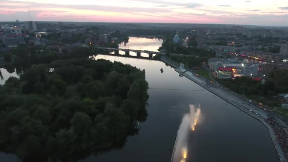 Music Fountain On The River. Aerial shot of the beautiful night performance of colorful fountains