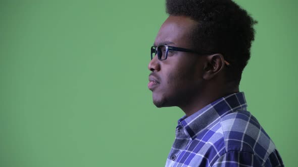 Closeup Profile View of Happy Young African Hipster Man Smiling