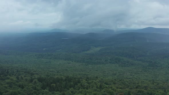 An aerial shot (dolly out) of the Seneca Creek Valley and the lookout tower on top of Spruce Knob, t