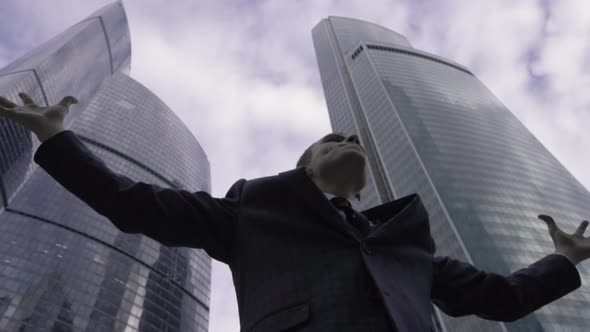 Young Successful Businessman Raised Hands to Celebrating His Victory