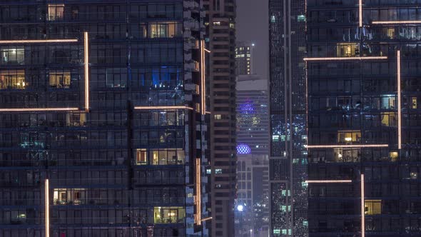 Flat Night Panorama of Multicolor Light in Windows of Multistory Buildings Aerial Timelapse