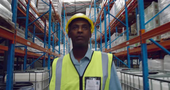 Male worker walking in a warehouse