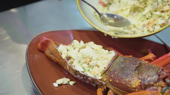 Chef Fills A Cooked Lobster