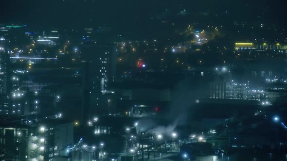 night timelapse with industry smoke and traffic