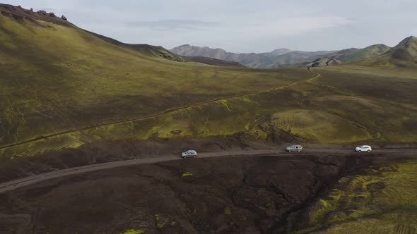 Car rides on a dirt road. Iceland landscape.